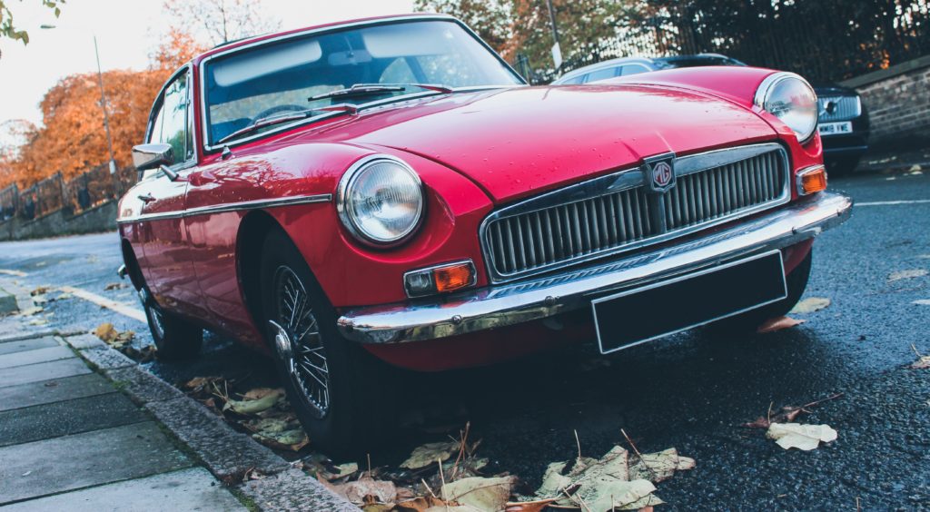 red antique car in the fall
