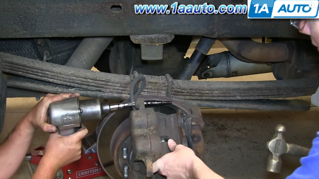 Use an impact wrench to remove the slide bolt that came out with the sticking brake caliper