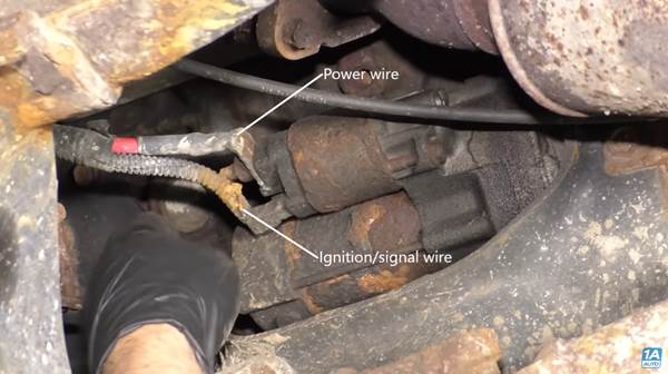 Reasons A Car Won't Start | You may need to test the power wire, as our mechanic does in this photo.