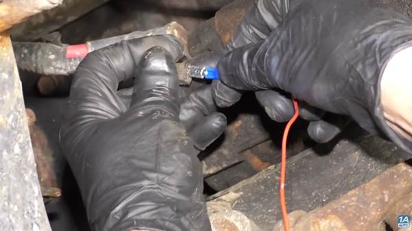 Reasons A Car Won't Start | You may need to test the ignition/signal wire, as our mechanic does in this photo.