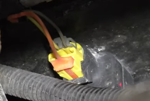 Front impact sensor on the 02-006 Chevy Avalanche, located behind the front bumper cover