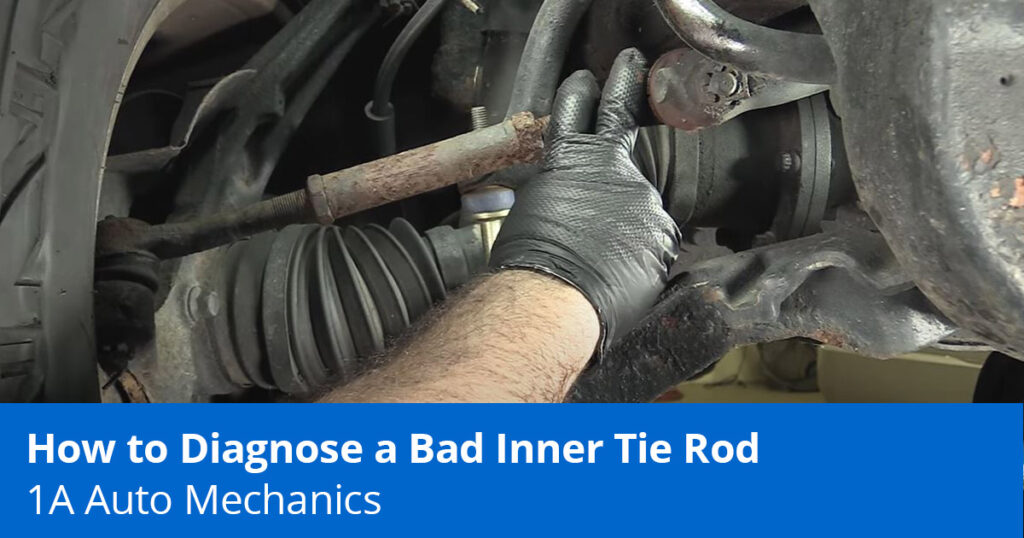 Mechanic Showing how a Tie Rod can cause a loose steering wheel