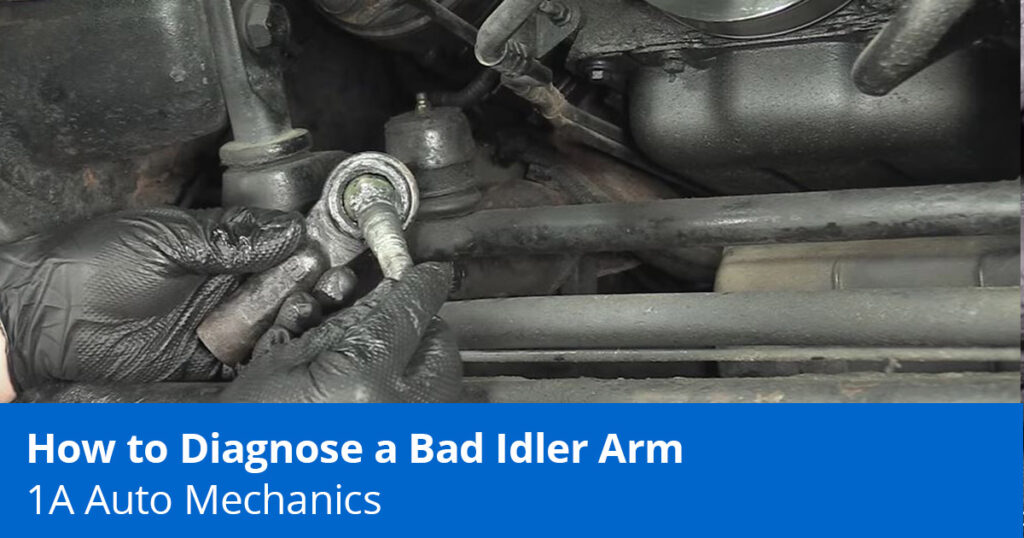 Mechanic showing a bad idler arm