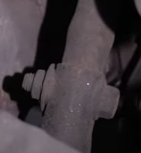 Steering intermediate shaft inside a 1st gen Chevy Silverado's engine compartment