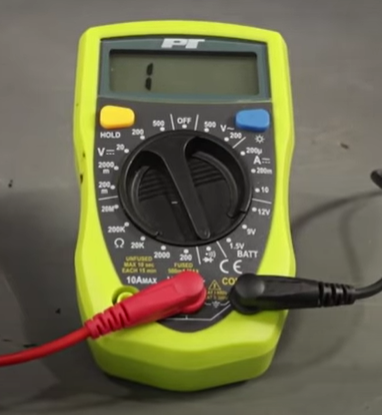 Digital multimeter reading the number 1 on the digital screen, meaning there is an open circuit