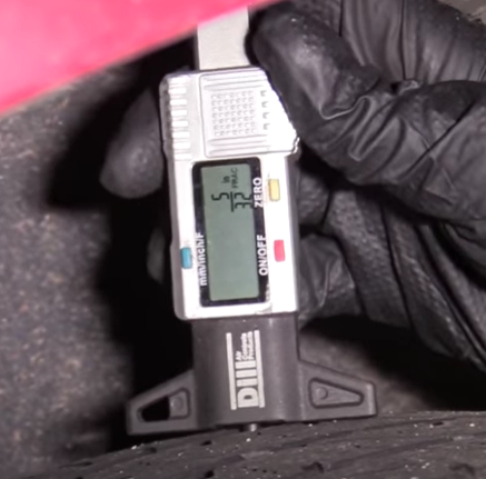 Check tire tread for wear with a tire tread gauge