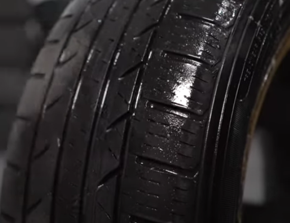 Soapy water on tire treads indicating no leak
