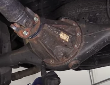 Pointing to the rear differential gasket on the 3rd gen Tacoma