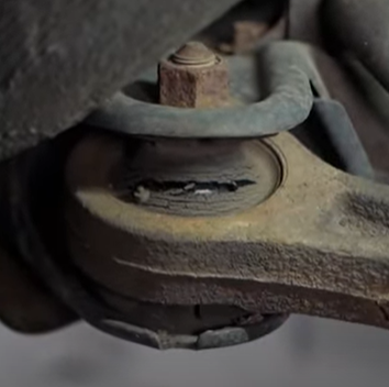 Cracked and defective rearward control arm bushing on the 1st gen Honda Pilot