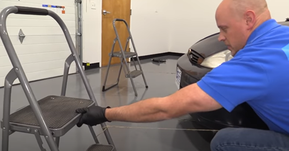 Placing a stool with string within reaching distance of the tire