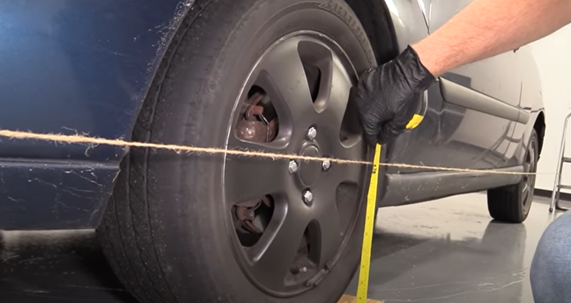 Measuring the height of the string to the center of the tire