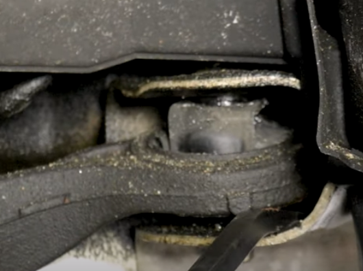 Pry bar in a loose lower control arm bushing on the 3rd gen Acura TL