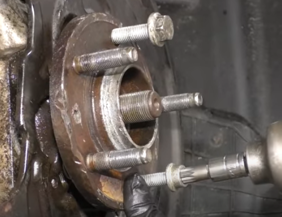 Tighten a puller bolt to a wheel hub assembly