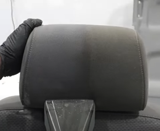 Cleaning the seat with an industrial carpet cleaner