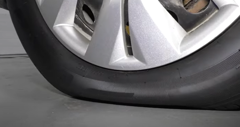 Tire that has too little air to drive a car with