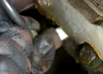Wiggling a spark plug wire free from a spark plug