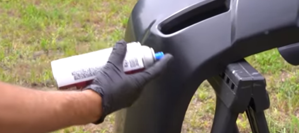 Painting a plastic bumper with a spray can