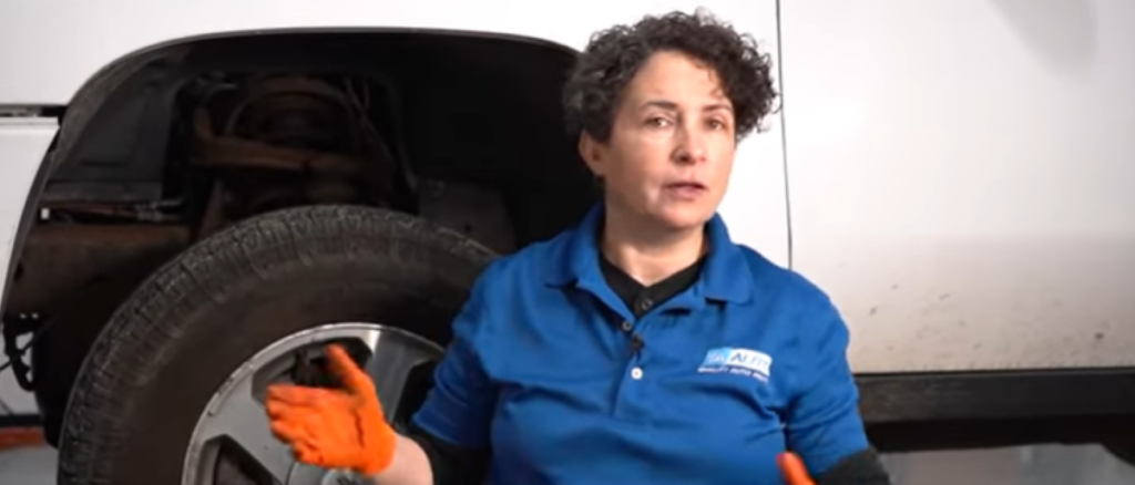 1A Auto mechanic reviewing how to diagnose a howling or grinding wheel bearing