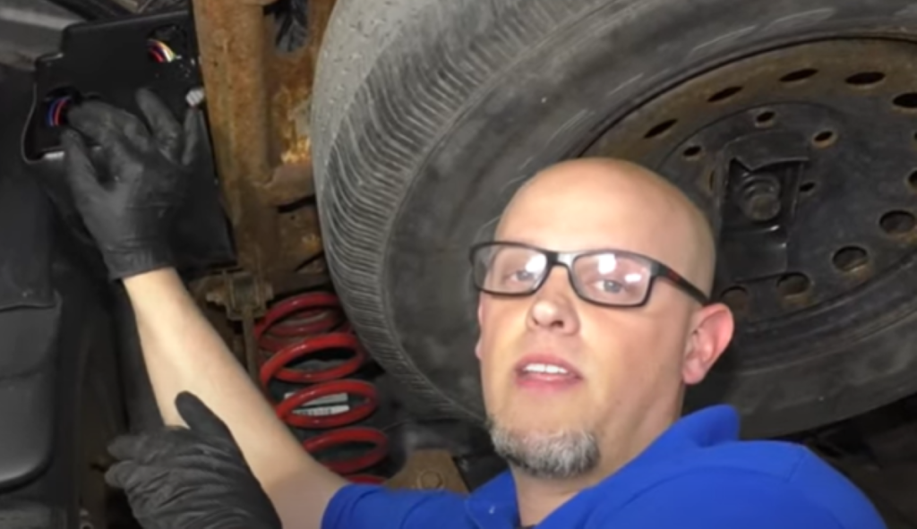 Mechanic reviewing common GM air suspension problems