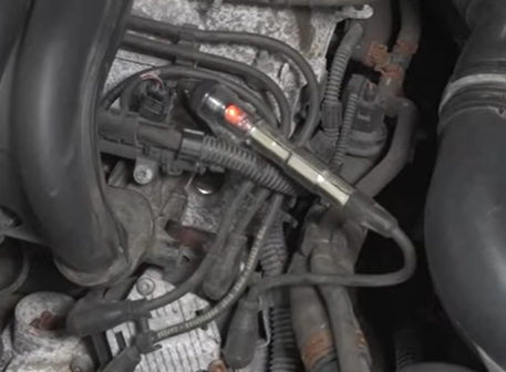 Testing the ignition coil pack with a spark tester on the 2011 to 2018 Volkswagen Jetta
