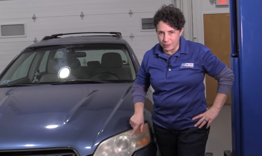 1A Auto mechanic reviewing how to remove headlight haze by replacing it