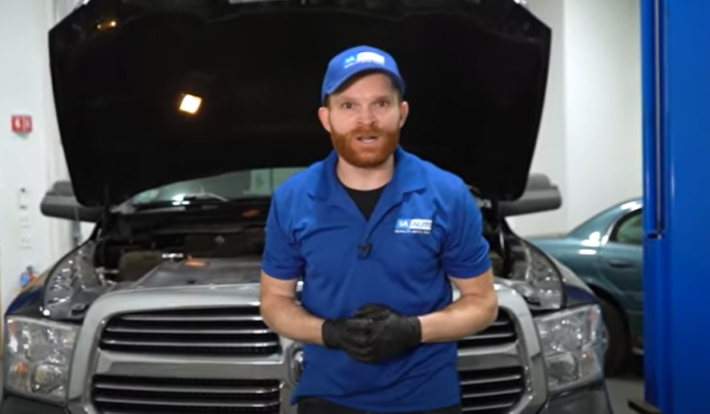 1A Auto mechanic reviewing why an engine could make squeaks and how to diagnose it