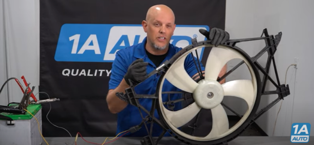 1A Auto mechanic reviewing how a bad radiator cooling fan can cause your car's AC to blow warm air