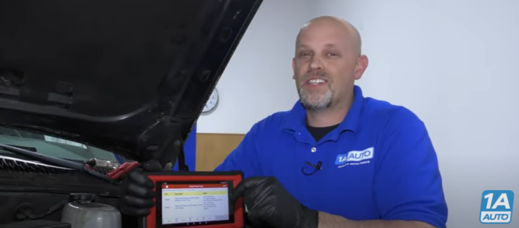 Mechanic under the hood reviewing what can cause code P0443