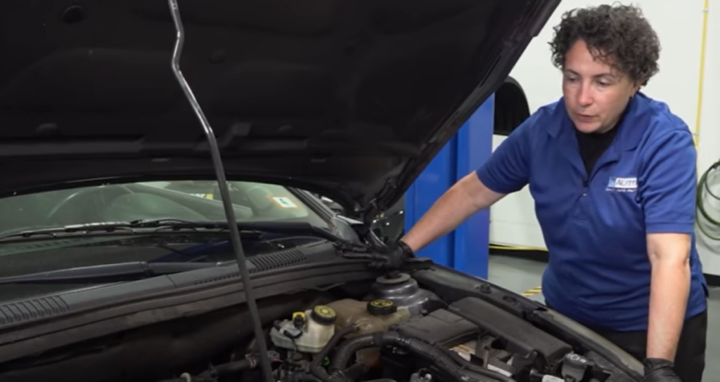 1A Auto mechanic reviewing parts that can cause bad gas mileage