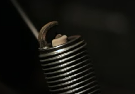 Tip of a spark plug gap that can cause engine sputtering