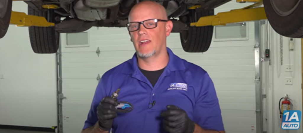 Mechanic reviewing how faulty O2 sensor can cause poor gas mileage and their symptoms when they go bad